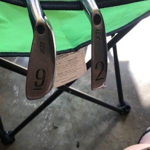Two pro guard Wilson number nine and number two golf clubs